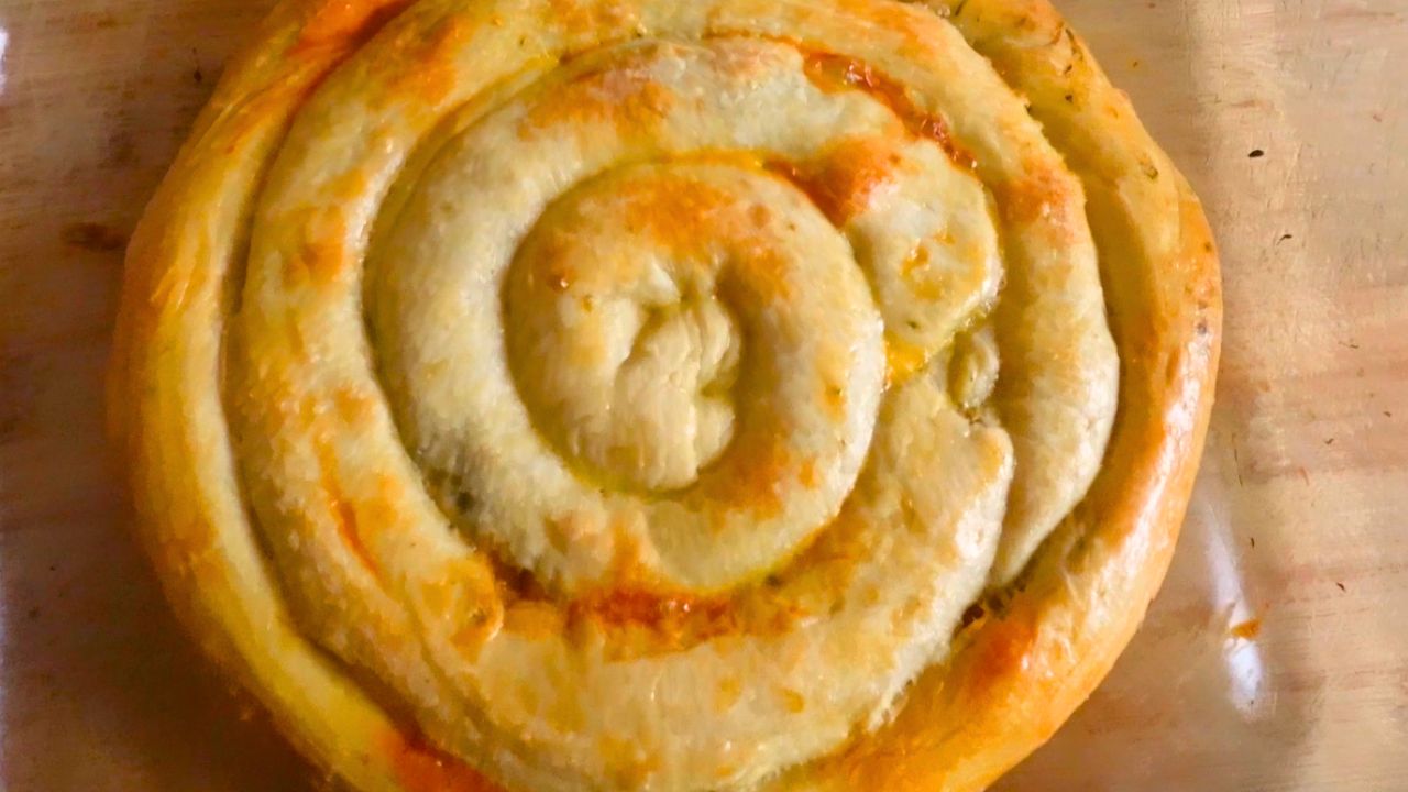A circular burek sits on a counter