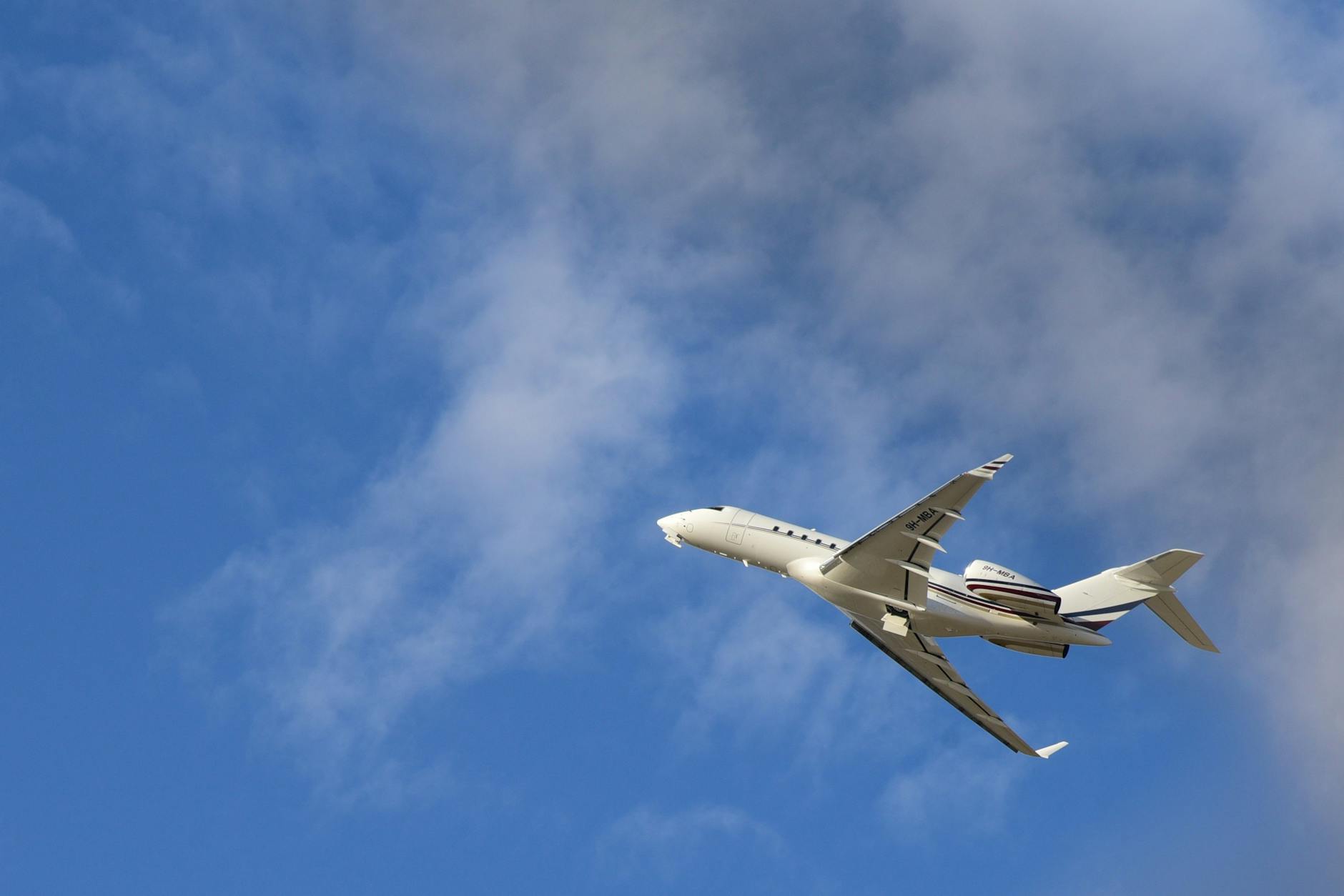 passenger plane soaring against clear blue sky